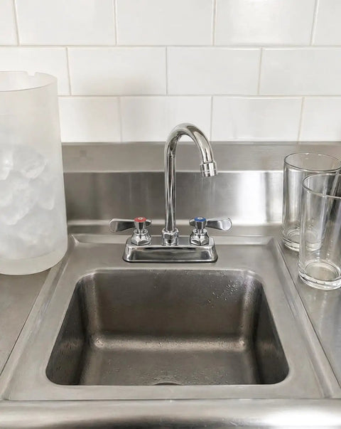 Heavy Duty Commercial Gooseneck Faucet Deck Mount Two Handle Solid Brass Build Chrome Finish Rust Resistant Kitchen Bath Sink Fixture Built Different For The Long Haul with clean stainless sink and glasses.