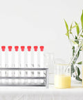 Premium Aluminum Test Tube Rack Stand For Lab Safety Small Test Tubes Metal Holder with test tubes and beakers in lab setting.