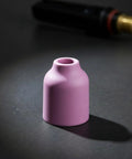 Pink ceramic nozzle cup from Heavy Duty Tig Torch Consumables Kit With Copper Collet Body And Clear Cup For Clean Welds.