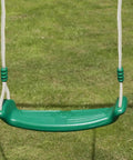 Green swing seat hanging from white rope on grass. Heavy Duty Nylon Rope Seven Eighths Inch By One Hundred Feet White Rope For Anchoring, Tree Work, Cargo Hauling, DIY Projects And Outdoor Use, UV Moisture And Abrasion Resistant Cord Built Tough.