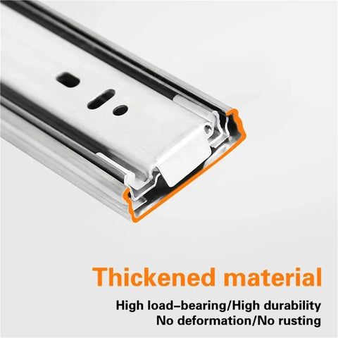 Close-up of stainless steel drawer runners with soft close slides for smooth quiet drawer gliding in kitchen office workshop cabinets