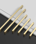 10 Pack 5 Inch Brushed Gold Cabinet Pulls For Kitchen Cabinets Cupboards And Drawers Durable Cabinet Hardware displayed on table