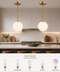 Mid Century Modern 1 Light Pendant Light With White Glass Globe Shade And Gold Finish Brushed Brass Fixture over kitchen island