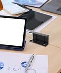 Slick Under Desk Laptop Mount Bracket With Effortless Angle Tilting And Quick Clamp Install on wooden desk with tablet.