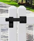 16 Piece Iron Gate Latch And Heavy Duty Fence Lock With Gravity Bolt Design on a white fence, ideal for secure yard access.