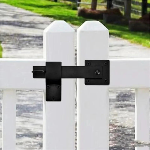 16 Piece Iron Gate Latch And Heavy Duty Fence Lock With Gravity Bolt Design on a white fence, ideal for secure yard access.