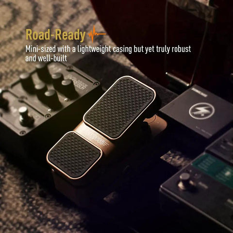 Passive Volume And Expression EXP Pedal For Guitar And Keys Mini 2 In 1 with textured surface on pedal board