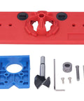 Front view of red hinge drilling guide base with blue mounting jig, drill bits, screws, and Allen key.