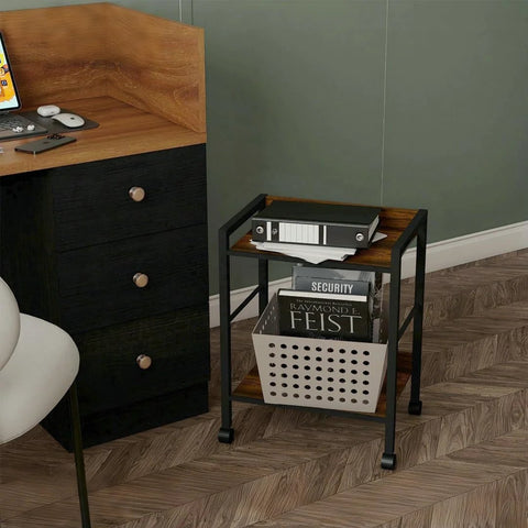 Two Tier Rolling Utility Cart with Brown Wood Shelves and Black Metal Frame on Wheels next to a desk in an office setting.