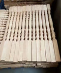Upgrade Your Space With Premium Replacement Wood Balusters And Stair Spindles For Quick Porch Fixes, Classic Carved Poplar Columns ready for indoor rails, massive 30 pack of 37 inch posts showing stacked spindles.
