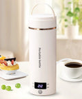 Portable Travel Electric Kettle With Four Temperature Presets 400Ml Mini Hot Water Boiler In 304 Stainless Steel on table