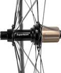 Rear hub detail of Dope Carbon Road Wheelset With Basalt Braking Surface, 38mm Rim Depth, 23mm Inner Width, 700c Clincher, Matte 3K Finish.
