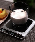 Smart USB Coffee Mug Warmer With Three Temp Settings Keeps Your Daily Brew Nice And Toasted Flat Bottom Heat Pad For Office Home Desk Warm Drink Setup with glass cup on black pad.