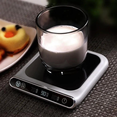 Smart USB Coffee Mug Warmer With Three Temp Settings Keeps Your Daily Brew Nice And Toasted Flat Bottom Heat Pad For Office Home Desk Warm Drink Setup with glass cup on black pad.
