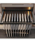 Expandable Trouser Rack With Silent Glide Rails And Drawer Pants Hanger System featuring stacked trousers in a sleek black frame.