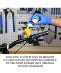 All In One Bike Hydraulic Disc Brake Bleed Kit With 12 Oil Filling Joints And Transferable Funnels in use on bike handlebar