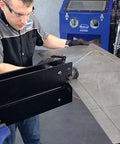 Technician using Elite Bead Roller With 27 Inch Throat Capacity for Floor Pans Firewalls trunk floors and inner fenders in metal shop
