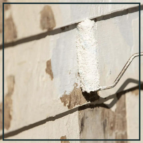 Wall section with High Build Peel Bonding Primer For Durable Seal applied, showing primer coverage over cracks and stains.