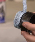Applying Megaloc Multi-Purpose Thread Sealant For Pipes And Fittings, Blue Liquid Paste, 16 Oz Can on a plastic pipe thread