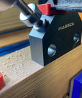 Pro Level Dowel Jig Kit Featuring Three Precision Drill Guide Bushings And Matching Bits, detailed view of drilling setup on wood.