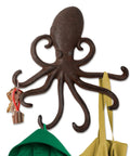Rad Cast Iron Octopus Wall Hook Rustic Brown Antique Finish with keys and bags hanging from sculpted tentacles.