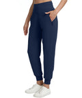Person wearing Fleece Lined Womens Joggers With Zip Pockets High Waist Athletic Pants For Travel Lounge And Workout Lightweight Warm Navy Blue Plus Size 3XL