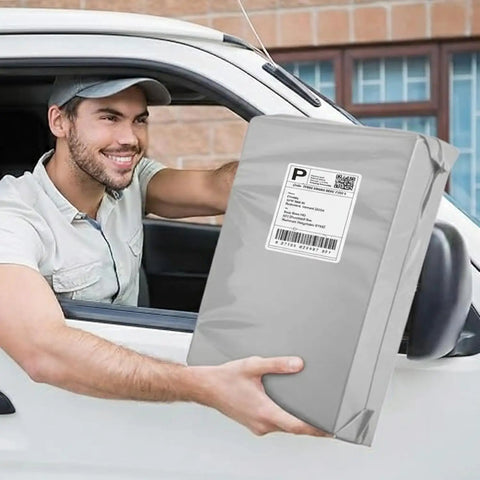 Heavy Duty Weatherproof 12x15.5 Poly Mailers 100 Pack Self Seal Waterproof Shipping Bag being held out of car window