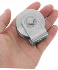 Hand holding Heavy Duty Stainless Steel Pulley Wheel Set for Sliding Door Tracks, showing compact size and high load capacity.