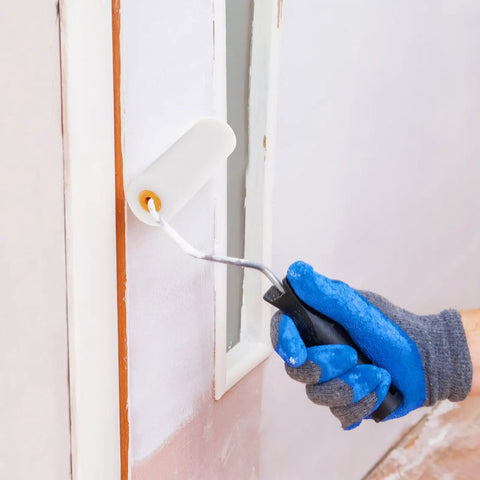Hand using a mini foam paint roller on a wall with gloves applying glossy paint with 10 Pack High Density Foam Paint Roller Covers Mini Wall Paint Rollers Quick And Dirty Setup Knockout Coverage For Water Based And Oil Based Paints Gloss Stains Real Smooth Finish Home Workshop Needs.