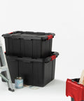 Heavy Duty Plastic Storage Totes With Secure Snap Lids For Garage Shed Organization 15 Gallon 18 Pack stacked next to a ladder.