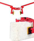 Beater Proof Heavy Duty Stone Lifting Clamp For Granite Slabs And Concrete Blocks Adjustable Rock Carrier Tongs For Construction Roadwork Landscaping Demolition Jobs Easy Grip Job Site Tool with yellow grips on a concrete block.