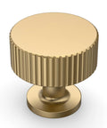 Close-up of Champagne Bronze Cabinet Knobs 10 Pack Single Hole 1 Inch Drawer Pulls for Kitchen and Bathroom Cabinets, ribbed design.