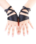 Dope Women Fingerless Gloves Crafted From Supple Faux Pu Leather For Nightouts And Punk Scenes Ultra Flexible Half Palm Wrist Cuff In Classic Matte Black Finish worn on hands with crossed straps.