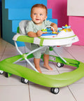 Baby using a walker with green frame and swivel wheels, showcasing 4 pcs baby walker wheel replacement casters with 0.3 inch mounting hole.