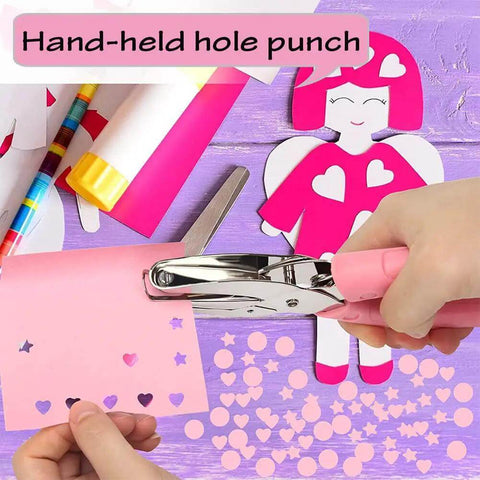 Person using Heart Shaped Paper Punch Handheld Perforator for DIY crafts, creating heart-shaped holes in pink paper on a colorful craft table.