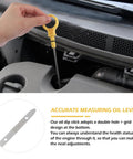 Hand using Professional Double Hole Engine Oil Dipstick Replacement OEM CJ5Z6750A for oil level check in car engine bay.