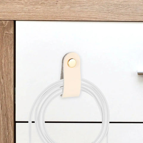Slick Double Pack PU Leather Cord Organizer Ties For Reusable USB Charger Straps and Earphone Holders, beige cord with snap close.