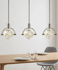 Lamparko Small Pendant Light Fixture with Crystal Cube, Brushed Nickel, three hanging lights over a dining table.