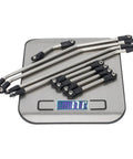 Optional stainless links for Ultra Light Carbon Fiber LCG Chassis Kit For 1/10 RC Crawler Rigs displayed on a digital scale