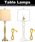 DIY Lamp Rewire Kit With 12 Ft Cord, 3-Way Brass Socket, gold table lamp with illuminated bulb and cord.