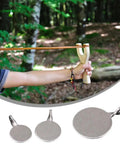 Using slingshot in forest with Six Pack Beefy Heavy Duty Metal Reset Target Set, durable steel targets with 2cm, 3cm, 4cm bullseye.