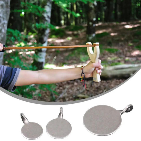 Using slingshot in forest with Six Pack Beefy Heavy Duty Metal Reset Target Set, durable steel targets with 2cm, 3cm, 4cm bullseye.