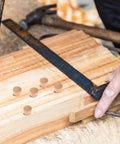 Natural Wood Screw Hole Plugs For Beehives And DIY Projects on a wooden board with measuring tools