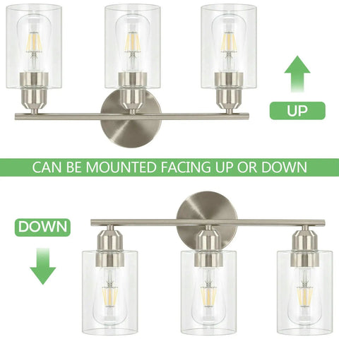 Three Light Bathroom Vanity Light In Brushed Nickel Finish With Clear Glass Shades Wall Mounted Over Mirror Hardwired Installation