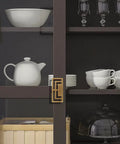 4 Pieces 3.93 Inch Gold Zinc Alloy Cabinet Handles With Hollow Geometric Design installed on a dark cabinet door