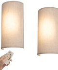 Fabric Wall Sconce Lighting 11.8 Inch Tall Two Pack with Remote, linen sconces lit in warm mode. Remote control visible.