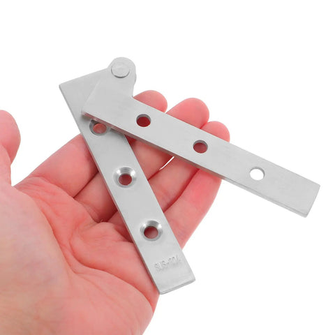 Four Pack Stainless Steel Pivot Hinges With Thickened Design And Rotating Shaft held in hand, showcasing concealed hinges for modern interiors.