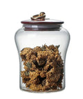 Secure Airtight Borosilicate Glass Storage Jar With Heavy Duty Metal Lifting Lid storing dried flowers for tea or culinary use.