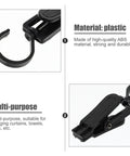 Close-up of black rotatable plastic curtain clips with swivel hooks showing durable ABS material and multi-purpose use.