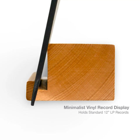 Legit Solid Hardwood Turntable Stand For LP Records And Album Jackets To Show Off Your Fresh Vinyl Collection While Spinning Tracks Without Messing Up Your Smooth Lounge Or Desk Area Setup, angled view of wooden display holding vinyl.